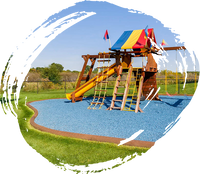 Playground with Playsafer royal blue rubber mulch surface.