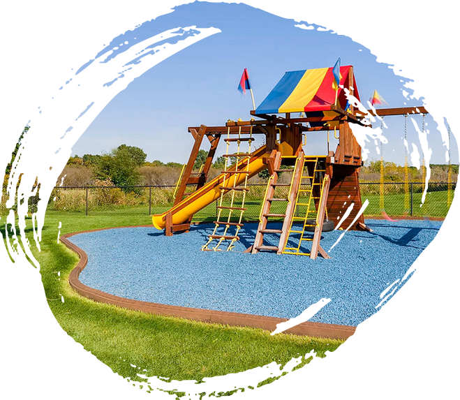 Playground with Playsafer royal blue rubber mulch surface.